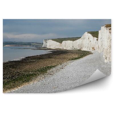 Öntapadós fotótapéta falra Sziklák óceán ég felhők beton fű