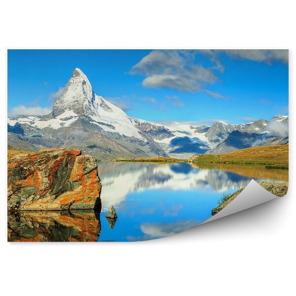 Fotótapéta Hegyek sziklák hó óceán ég felhők