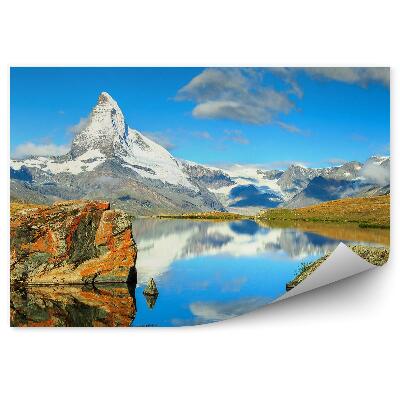 Fotótapéta Hegyek sziklák hó óceán ég felhők