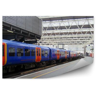 Fotótapéta Nagy fényes vasútállomás kék vonattal