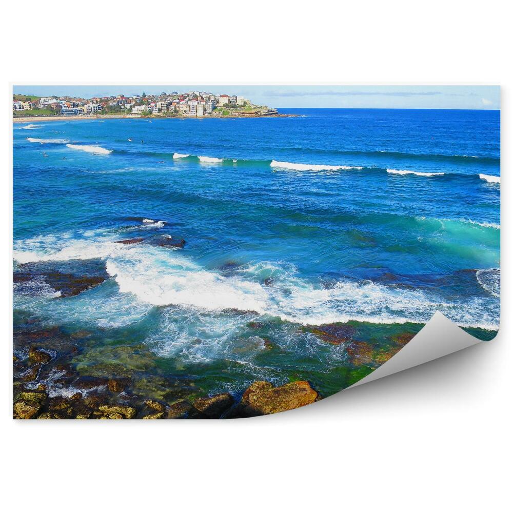 Öntapadó fotótapéta Épületek sziklák óceán emberek ég víz