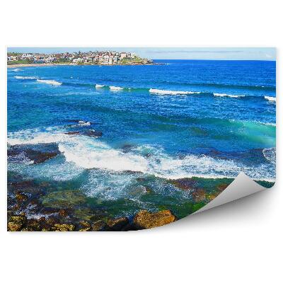 Öntapadó fotótapéta Épületek sziklák óceán emberek ég víz