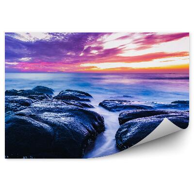 Öntapadós fotótapéta falra Kövek víz tenger színes égbolt felhők