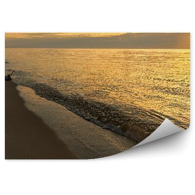 Fotótapéta Narancssárga napfény lábnyomok a homokon