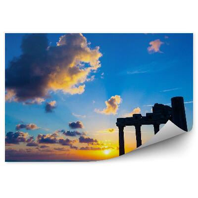 Fotótapéta Római romok a lenyugvó nap hátterében