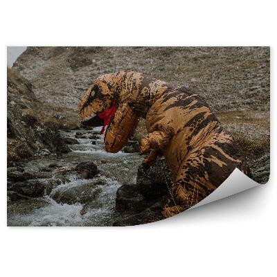 Fotótapéta Dinoszaurusz jelmez a háttérben egy hegyi patak