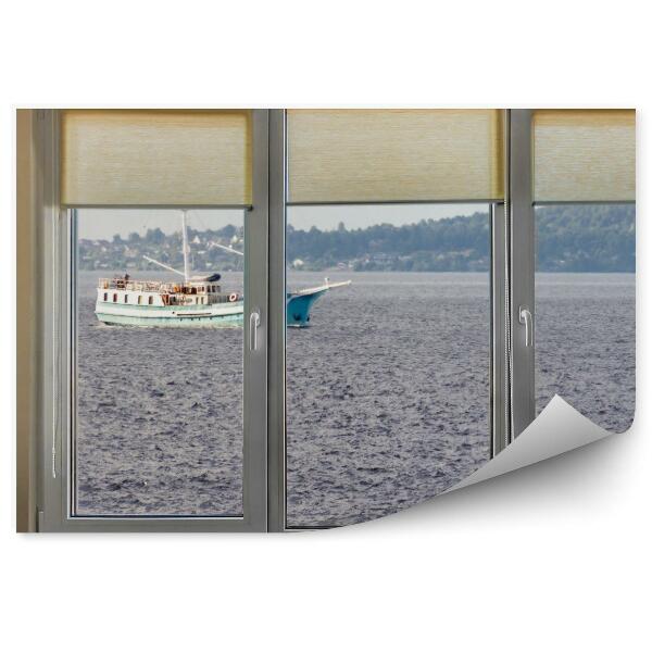 Fotótapéta Kilátás az ablakból a sötét tengerre és a hajóra