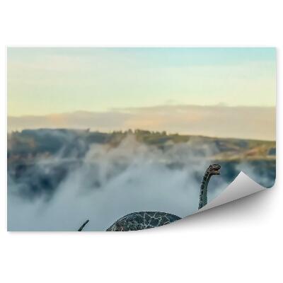 Öntapadós fotótapéta Egy brontosaurus figurája a dombok hátterében