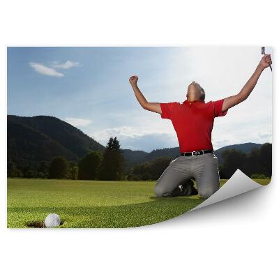 Fotótapéta Golfpálya labda lyuk hegyek játékos ég felhők