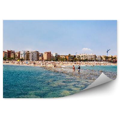 Fotótapéta strand kövek emberek épületek égbolt Barcelona