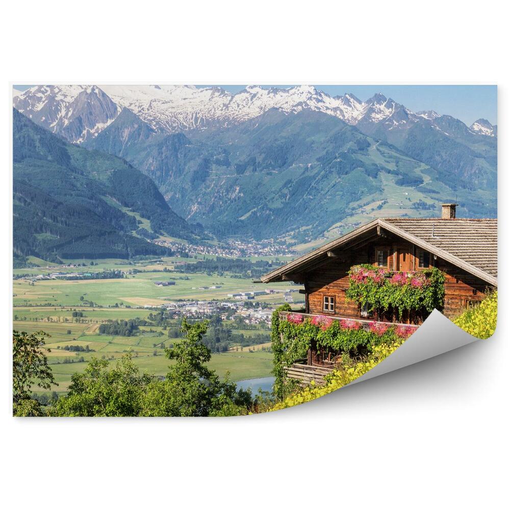 Öntapadós fotótapéta falra Alpok rét fák hegyek házak hó ég virágok