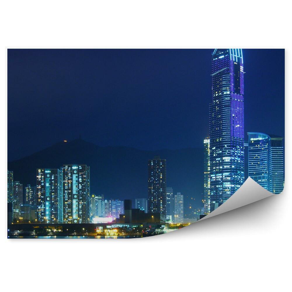 Fotótapéta A hongkongi felhőkarcolók megvilágítják az óceán éjszakáját