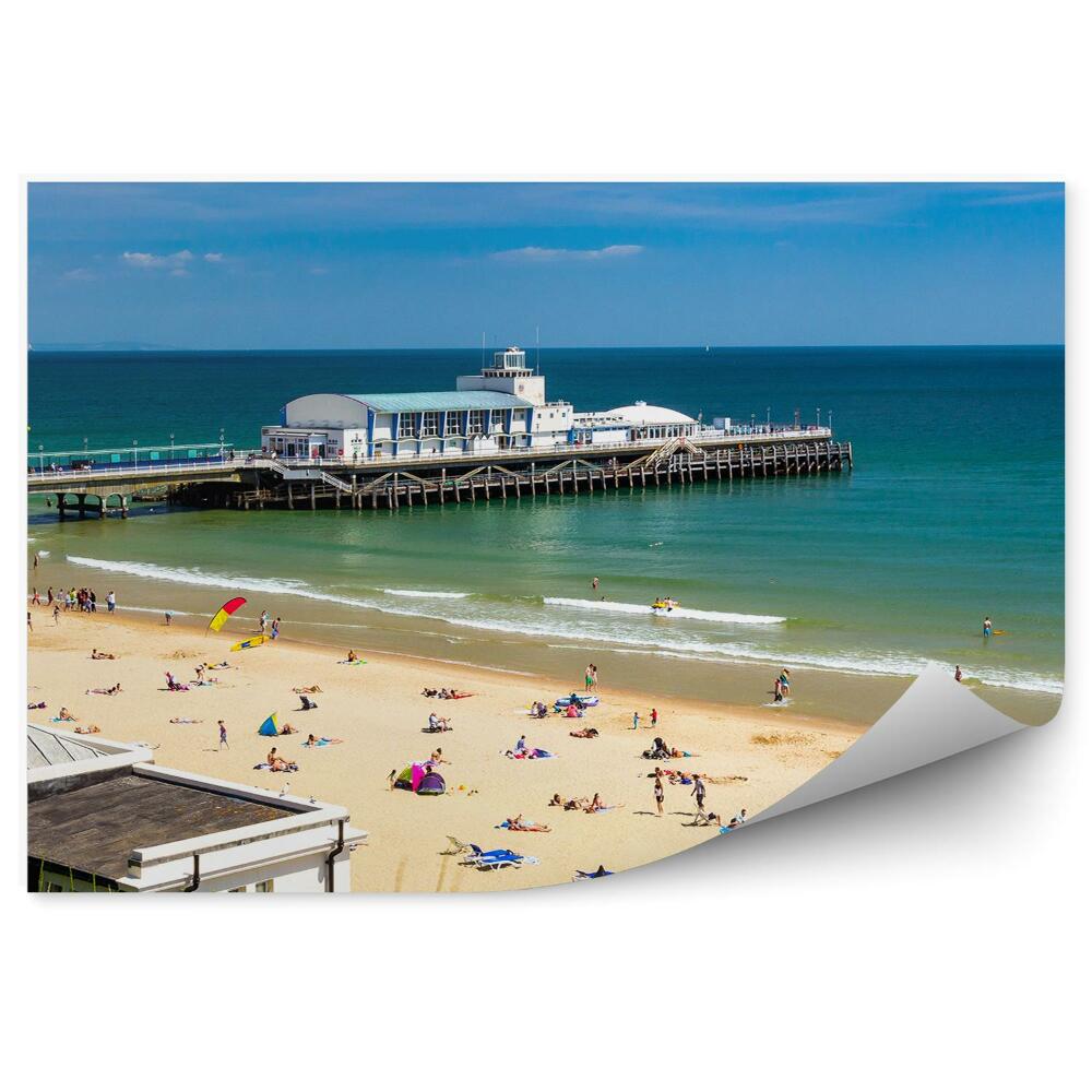 Öntapadós fotótapéta falra Épületek mólón sétány emberek fű óceán