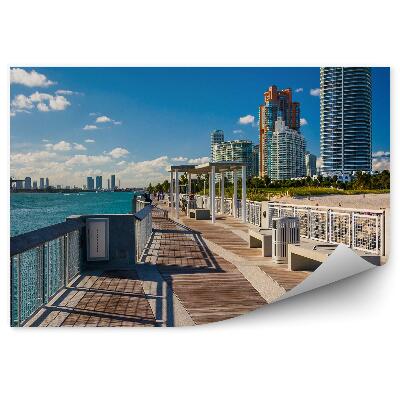 Modern fotótapéta Felhőkarcolók fák emberek tengerpart móló felhőkarcolók óceán ég felhők