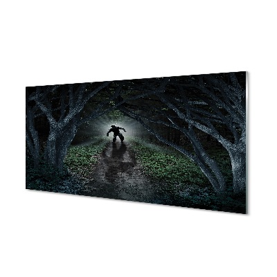 Egy alak egy sötét erdőben Üvegkép nyomtatás